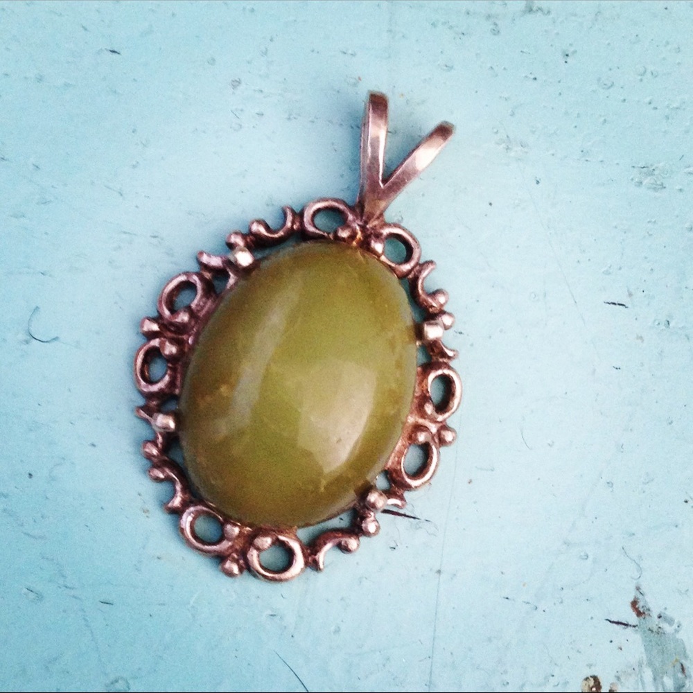 silver filigree pendant with green stone